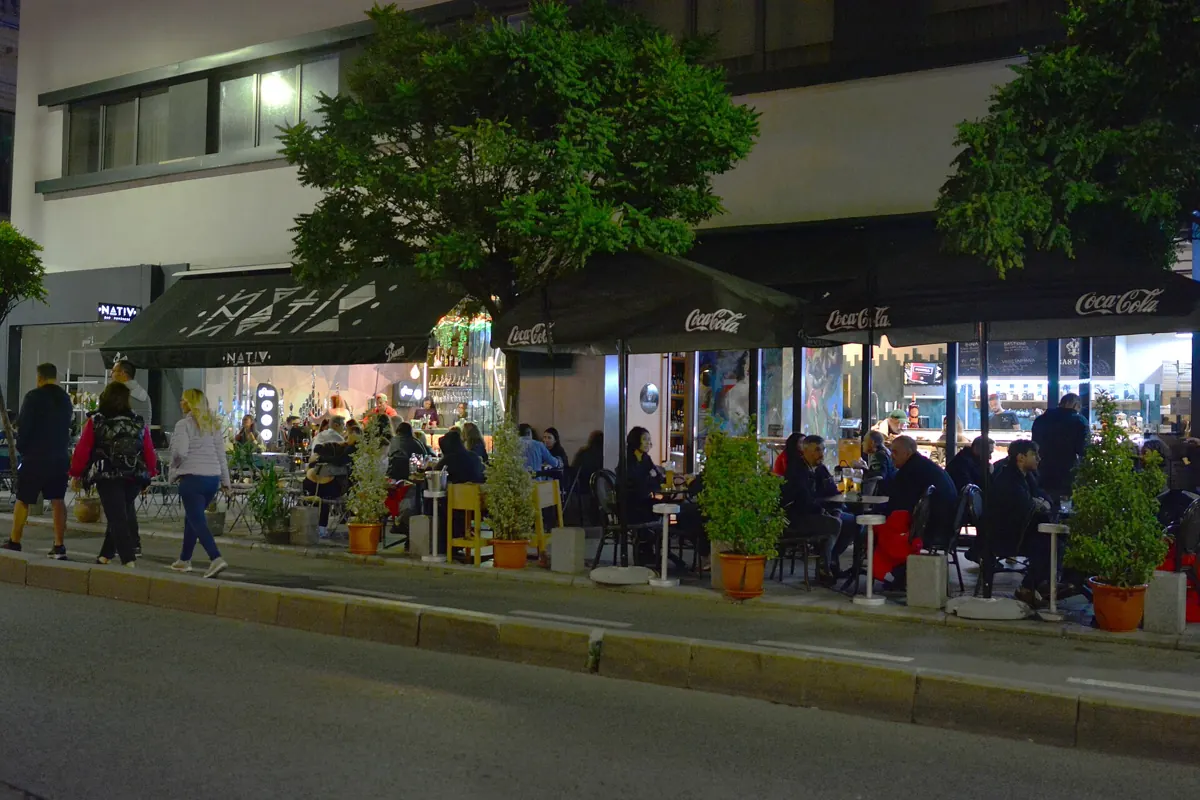 Calea Victoriei in the evening — the lit, busy axis back towards the hotels